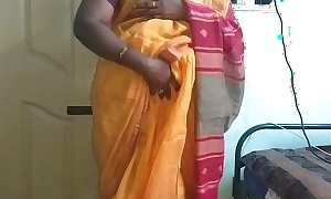 Desi indian sweltering tamil telugu kannada malayalam hindi slutty wife vanitha wearing orange colour saree showing big boobs and shaved snatch press changeless boobs press nip rubbing snatch masturbation