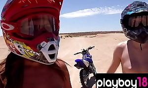 Big boobed badass unclothed babes taxing motocross in make an issue of desert