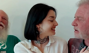 Young brunette has threesome with old men and she swallows cum